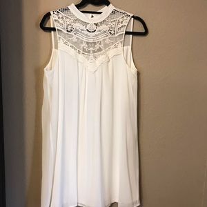 White Sleeveless Baby Doll Dress with Lace.